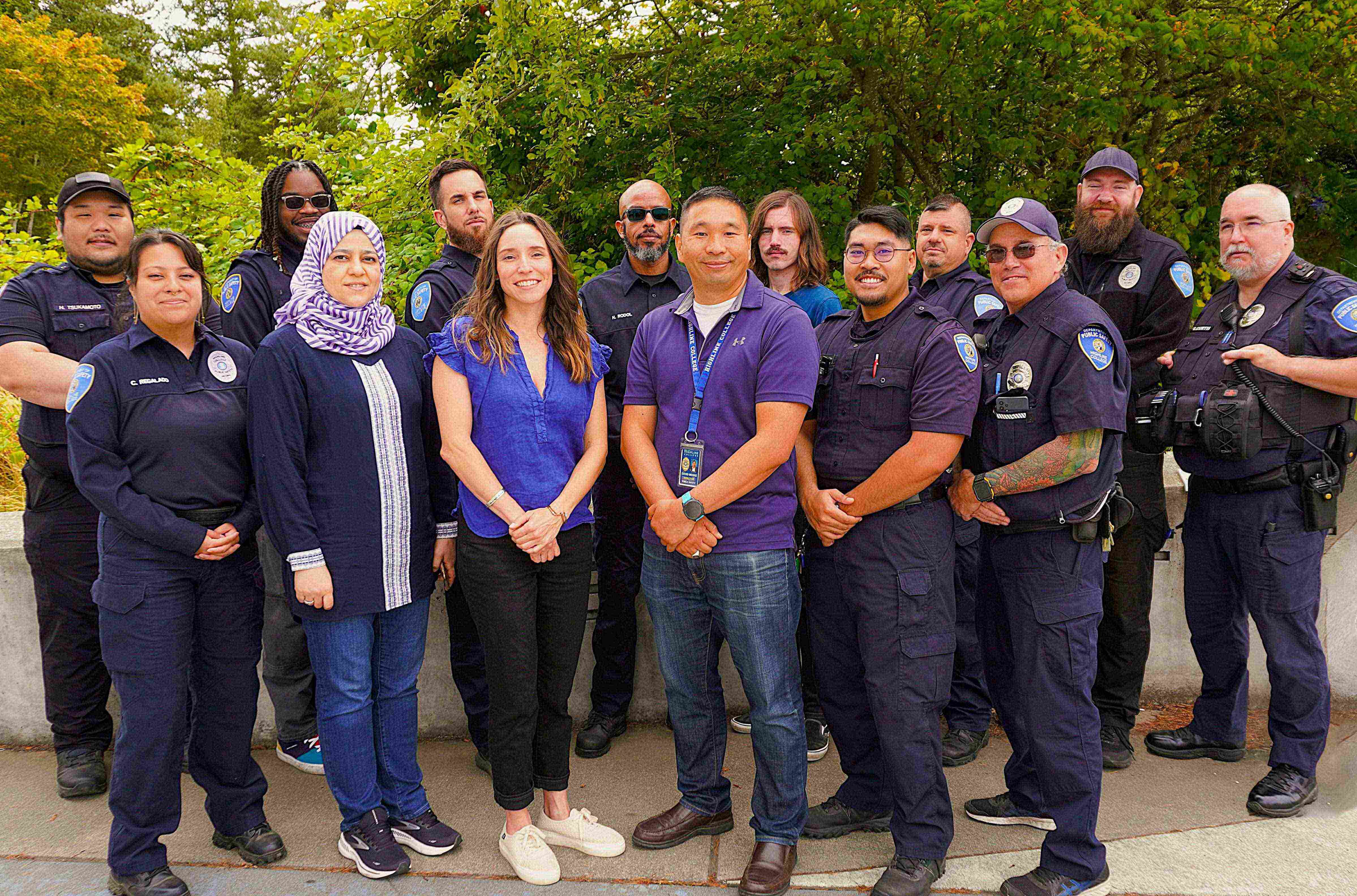 Public Safety team members standing in a group outdoors, with trees in the background