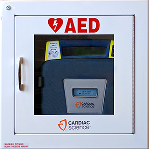 An AED inside of a wall cabinet