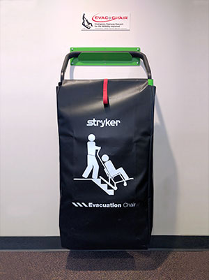 An evacuation chair mounted onto a wall